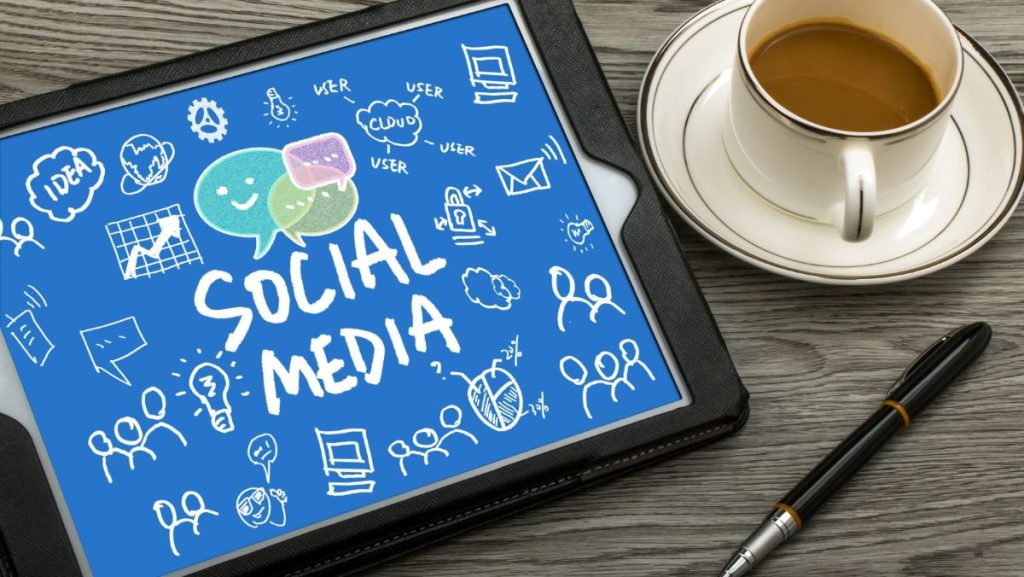 Tablet display showcasing 'Social Media' text alongside various social media platform icons